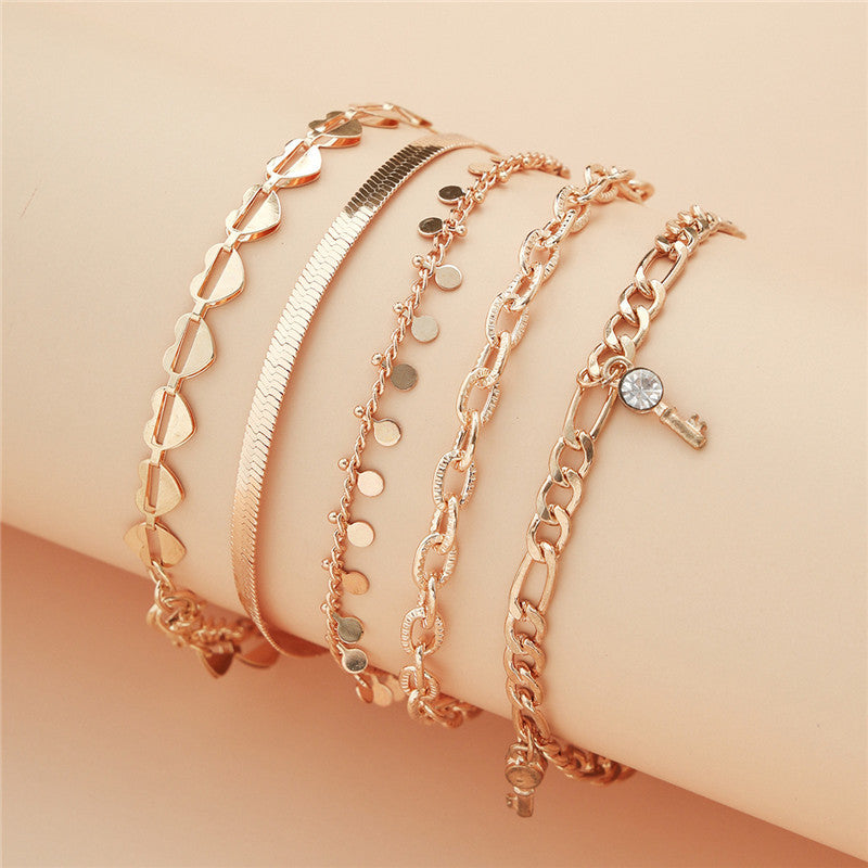 5-Piece Gold Heart Crystal & Snake Chain Anklet Set – Trendy Foot Jewelry for Women